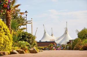 two white domes of a building with people in front at Seaside pet friendy escape butlins in Ingoldmells