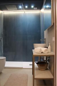 a bathroom with a shower with a sink and a toilet at Le Onde della Sicciara in Balestrate +49 photos