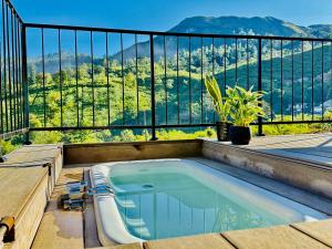a swimming pool on the balcony of a house at 007Dickoya in Dikoya