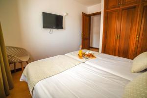 Łóżko lub łóżka w pokoju w obiekcie Agradable y familiar, con piscina "Casa Inima"