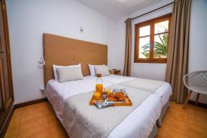 Łóżko lub łóżka w pokoju w obiekcie Agradable y familiar, con piscina "Casa Inima"