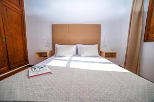 Łóżko lub łóżka w pokoju w obiekcie Agradable y familiar, con piscina "Casa Inima"
