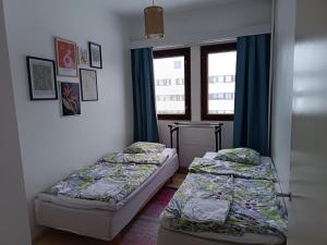 Postel nebo postele na pokoji v ubytování Lapland Story Home