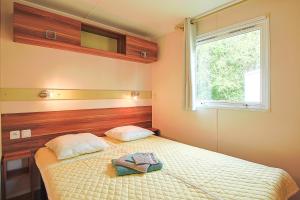 Ένα ή περισσότερα κρεβάτια σε δωμάτιο στο mobil-home - Le Marie Elodie 85 +36 φωτογραφίες