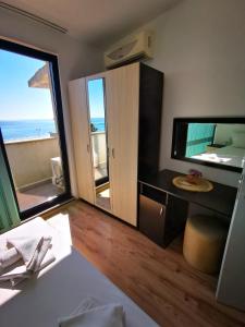 a hotel room with a view of the ocean at Azur Apartments in Sozopol