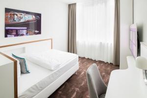 Postel nebo postele na pokoji v ubytování Mercure Hotel MOA Berlin