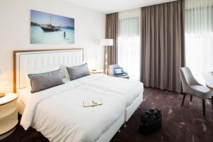 Postel nebo postele na pokoji v ubytování Mercure Hotel MOA Berlin