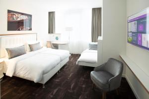 Postel nebo postele na pokoji v ubytování Mercure Hotel MOA Berlin