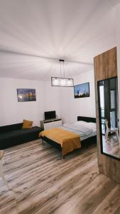 Posteľ alebo postele v izbe v ubytovaní Apartament w sercu Gdańska