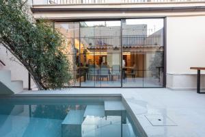 an external view of a house with a swimming pool at Casa Adela - Luxury Rural Accommodation in Castellonet
