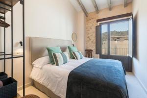 a bedroom with a bed and a large window at Casa Adela - Luxury Rural Accommodation in Castellonet +83 photos