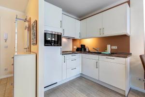 Η κουζίνα ή μικρή κουζίνα στο Residenz am Balmer See - BS 04 mit Wellnessbereich