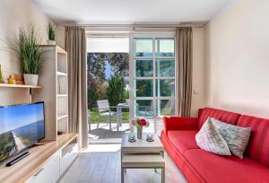 Μια τηλεόραση ή/και κέντρο ψυχαγωγίας στο Residenz am Balmer See - BS 04 mit Wellnessbereich