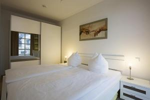 Ένα ή περισσότερα κρεβάτια σε δωμάτιο στο Residenz am Balmer See - BS 12 mit Wellnessbereich +13 φωτογραφίες