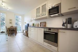 Η κουζίνα ή μικρή κουζίνα στο Residenz am Balmer See - BS 16 mit Wellnessbereich