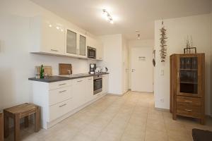 Η κουζίνα ή μικρή κουζίνα στο Residenz am Balmer See - BS 16 mit Wellnessbereich