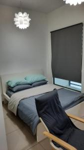 Ένα ή περισσότερα κρεβάτια σε δωμάτιο στο Spectacular Suite in the heart of Cyberjaya