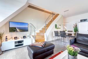 Μια τηλεόραση ή/και κέντρο ψυχαγωγίας στο Residenz am Balmer See - BS 65 mit Wellnessbereich