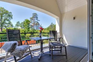 En balkon eller terrasse på Residenz am Balmer See - BS 70 mit Wellnessbereich