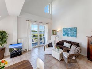 TV a/nebo společenská místnost v ubytování Residenz am Balmer See - BS 25 mit Wellnessbereich