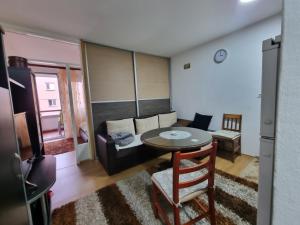 a living room with a couch and a table at Kenny in Zenica