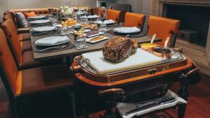 a table in a restaurant with a table set with food at InterContinental Bangkok by IHG in Bangkok