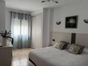 Postel nebo postele na pokoji v ubytování Hotel Ciudad Pozo Alcón