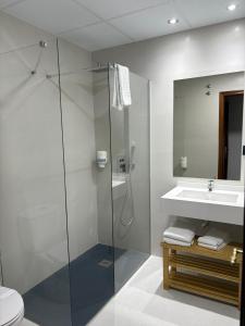 Koupelna v ubytování Hotel Ciudad Pozo Alcón