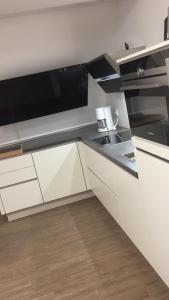 Kuchyň nebo kuchyňský kout v ubytování Residenz am Balmer See - BS 33 mit Wellnessbereich