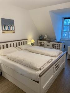Postel nebo postele na pokoji v ubytování Residenz am Balmer See - BS 33 mit Wellnessbereich + 17 fotografií