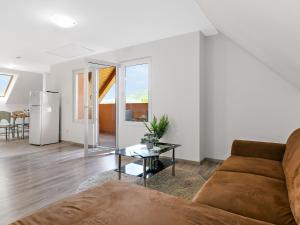 a living room with a couch and a table at Apartment Beate by Interhome in Badacsonytomaj