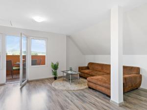a living room with a couch and a table at Apartment Beate by Interhome in Badacsonytomaj