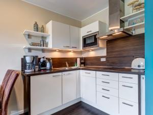 Kuchyň nebo kuchyňský kout v ubytování Residenz am Balmer See - BS 53 mit Wellnessbereich + 13 fotografií