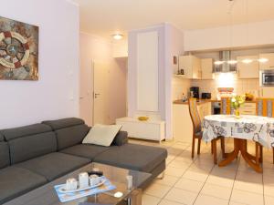 a living room with a couch and a table at Apartment Südwind App- 9 by Interhome in Zempin