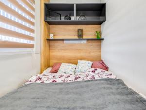 Voodi või voodid majutusasutuse Holiday Home Delux Eco by Interhome toas