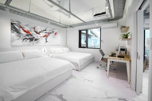 Postel nebo postele na pokoji v ubytování Fb Tailored Service Home Near Hongik Univ Station