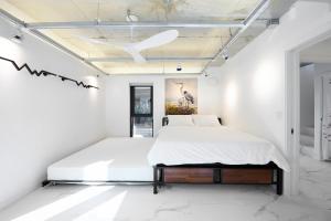 Postel nebo postele na pokoji v ubytování Fb Tailored Service Home Near Hongik Univ Station