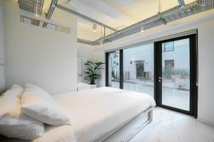 Postel nebo postele na pokoji v ubytování Fb Tailored Service Home Near Hongik Univ Station