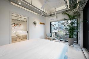 Postel nebo postele na pokoji v ubytování Fb Tailored Service Home Near Hongik Univ Station