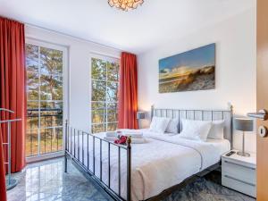 Ένα ή περισσότερα κρεβάτια σε δωμάτιο στο Ostseeresidenz Gorki- Park - 10 mit Wellness und Schwimmbad +12 φωτογραφίες