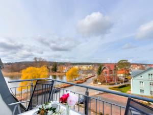 a balcony with a view of a river at Seehof Wohnung 1.33 in Bansin +11 photos