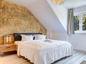 Postel nebo postele na pokoji v ubytování Bernsteinquartier BQ 9c Ostseenest