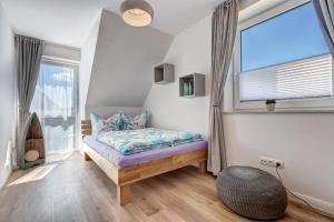 Postel nebo postele na pokoji v ubytování Haus Sternstunden