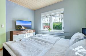 Postel nebo postele na pokoji v ubytování Ferienhaus Brakkelmann (Birkenhain)