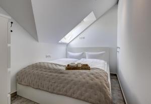 a bedroom with a bed with two candles on it at Ferienwohnung Carlotta in Trassenheide