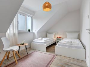 Postel nebo postele na pokoji v ubytování Bernsteinquartier BQ 10b