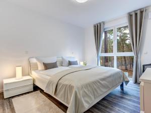 Giường trong phòng chung tại Bernsteinquartier BQ0557 - Bonjour