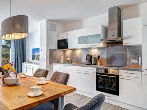 Kuchyň nebo kuchyňský kout v ubytování Bernsteinquartier BQ 09a - Ferienhaus Meeresrauschen