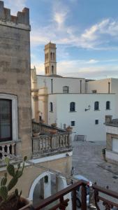 a view of a building with a clock tower at residence specchia in Specchia