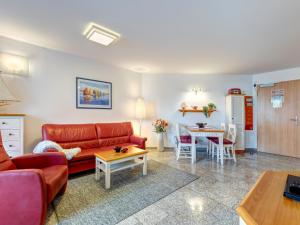 a living room with a couch and a table at Ostseeresidenz Gorki- Park - 03 mit Wellness und Schwimmbad in Bansin